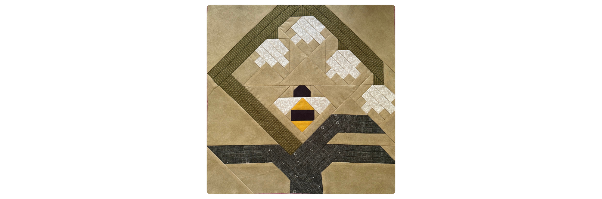HoneyBell Quilt Block, a quilt block with a flower and bee.